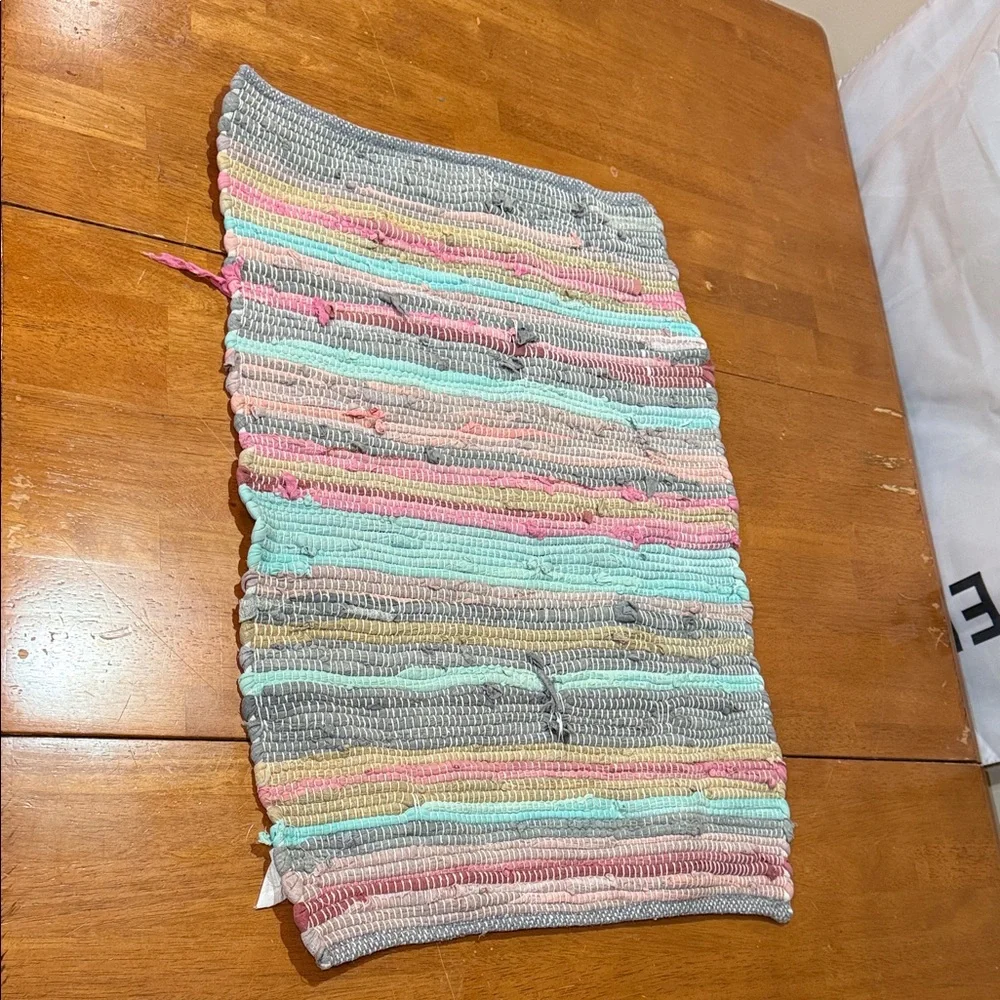 Woven multicolored rag rug.
